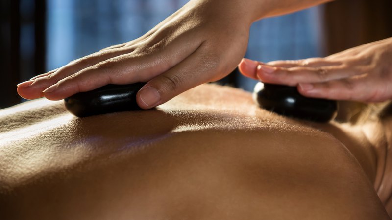 Hot Stone Massage using Swedish techniques along with smooth heated basalt stones