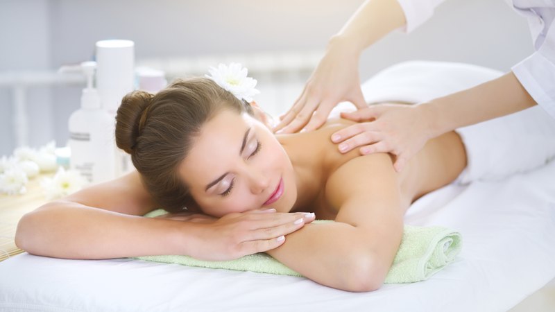 A woman relaxing while getting spa